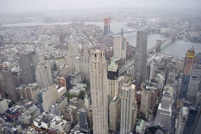 High angle view of modern buildings in city against sky