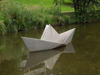 High angle view of paper floating on water in lake