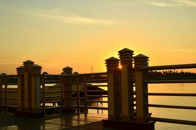 Silhouette of built structure at sunset