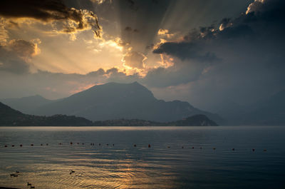 Scenic view of lake against sky during sunset