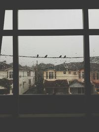 View of buildings through window