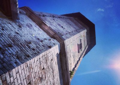 Low angle view of built structure against blue sky