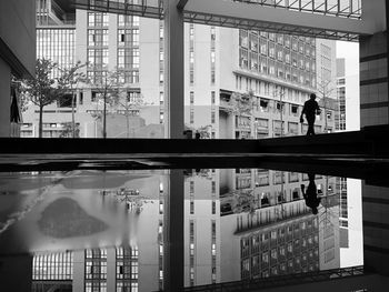Reflection of buildings on swimming pool in city