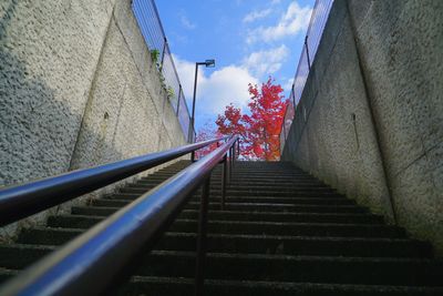 Staircase by building against sky