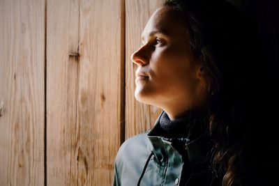 Close-up portrait of a young woman looking away