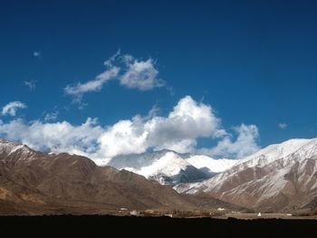 Scenic view of snowcapped mountains against sky