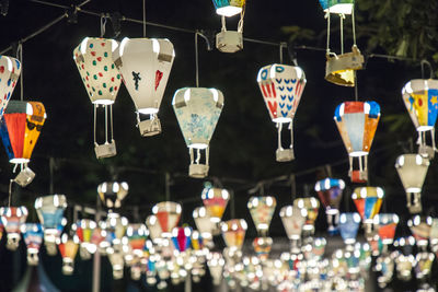 Close-up of multi colored decorations hanging at market stall