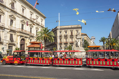 Beautiful square with a touristic red little train