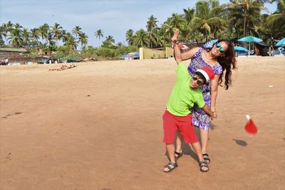 Children playing on sand at beach