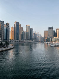 View of modern buildings in city against clear sky