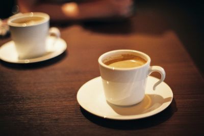 Close-up of coffee cup on table