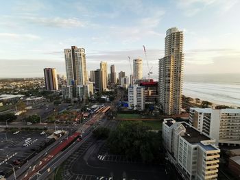 High angle view of road by buildings against sky