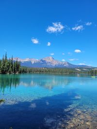 Scenic view of lake against blue sky