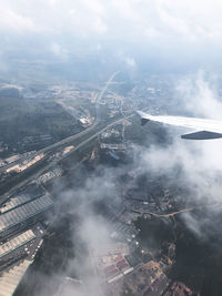 High angle view of city and buildings against sky