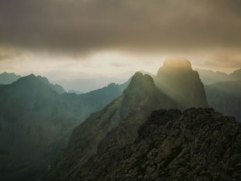 Fog over the mountain valley illuminated by the sunset. tatra mountains slovakia.