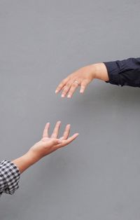 High angle view of woman hand over white background