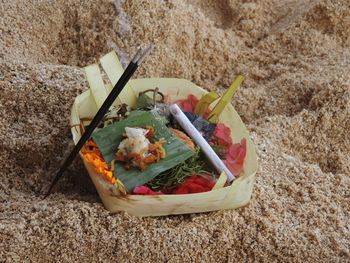 High angle view of food on rug at beach