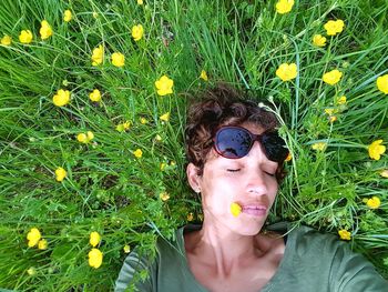 Portrait of boy blowing flowers