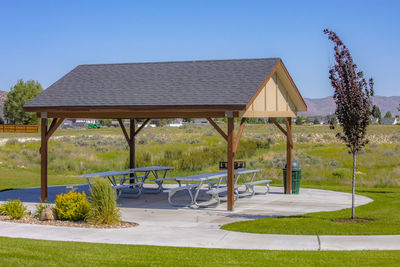 Gazebo on field against clear sky