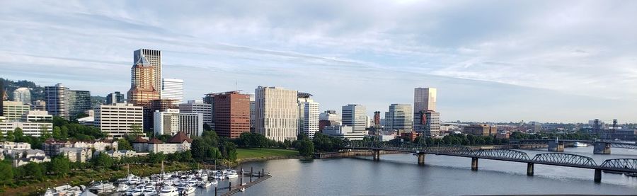 Modern buildings in city against sky