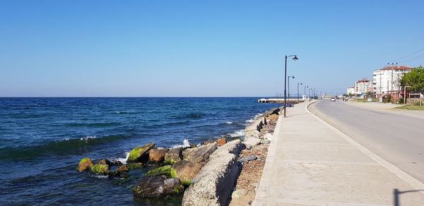 Scenic view of sea against clear blue sky
