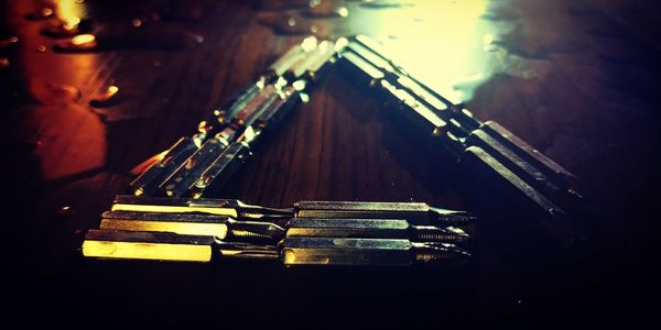 High angle view of metal arranged on table