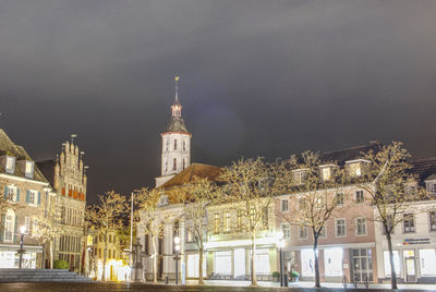 Illuminated buildings in city at night