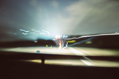 Colorful light trails against sky