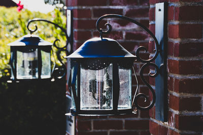 Close-up of old electric lamp on wall