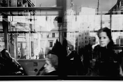 People in bus seen through windows