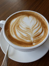 Close-up of cappuccino on table