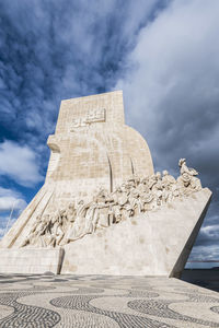 Low angle view of statue against cloudy sky