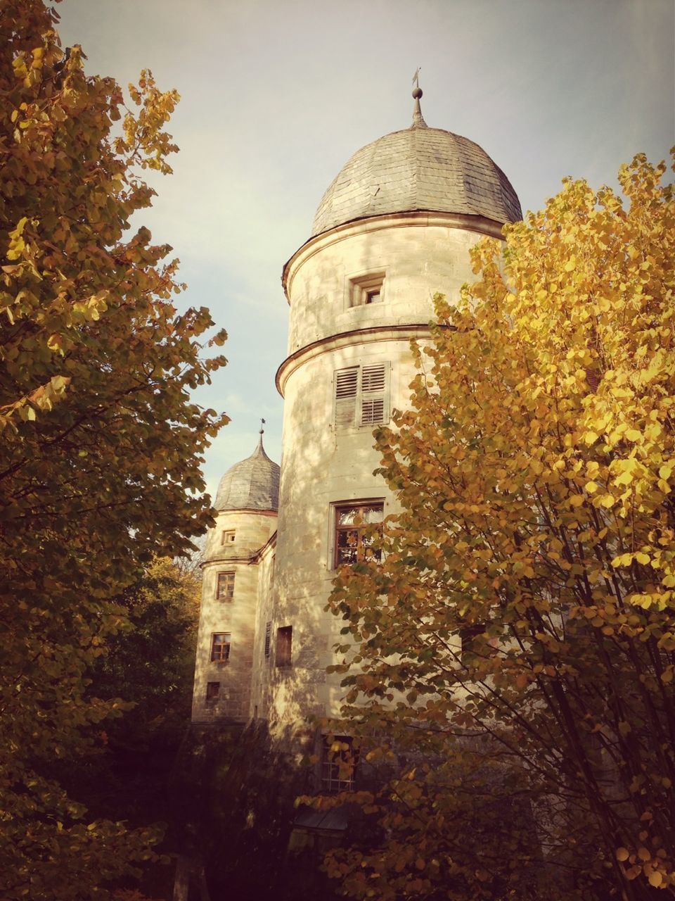 building exterior, architecture, built structure, religion, place of worship, church, spirituality, tree, low angle view, dome, sky, tower, cross, clear sky, cathedral, outdoors, day, no people