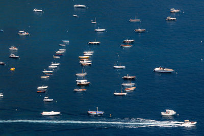 High angle view of sailboats moored on sea