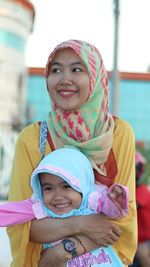 Portrait of happy girl with daughter