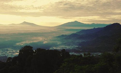 Scenic view of mountains at sunset