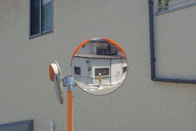 Reflection of building on glass window