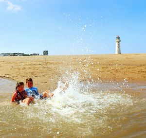 View of people on sea shore