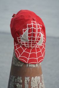 Close-up of red cap on traffic cone