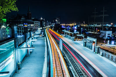 High angle view of light trails on road at night