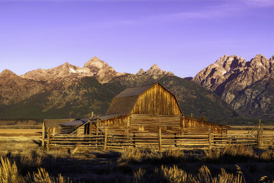 Scenic view of mountains against clear blue sky