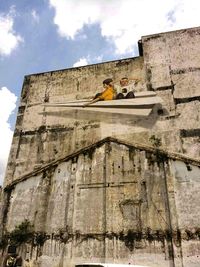 Low angle view of old building against sky