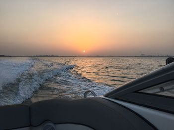 Scenic view of sea against clear sky during sunset