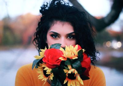 Close-up portrait of beautiful woman with flowers