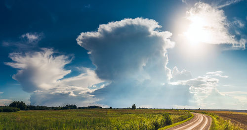 Panoramic view of field against sky