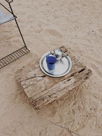 High angle view of coffee on beach