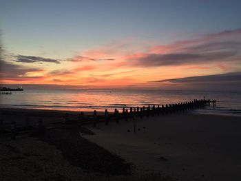 Scenic view of calm sea at sunset