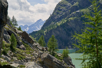Scenic view of mountains against cloudy sky