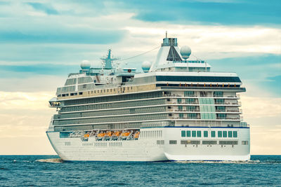 Ship sailing on sea against sky