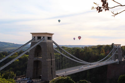 Low angle view of bridge against cloudy sky